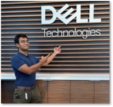 Manu in front of the Dell Technologies sign