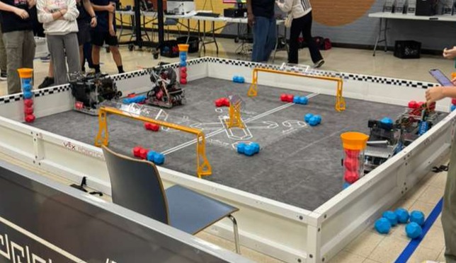 A VEX V5 competition field mid-match, robots at both ends